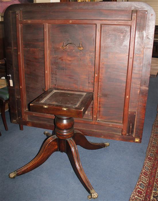 An early 19th century mahogany extending twin pillar dining table, Extended 10ft x 4ft 9.5in. x 1ft 1.5in.